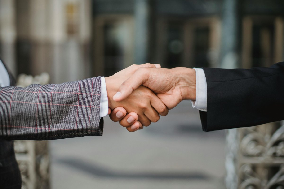 A professional handshake between two business people.